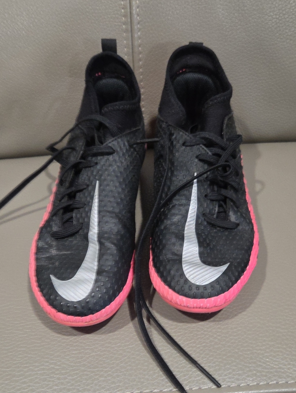 Nike Kids Black Athletic Shoes with Pink Trim and Silver Swoosh